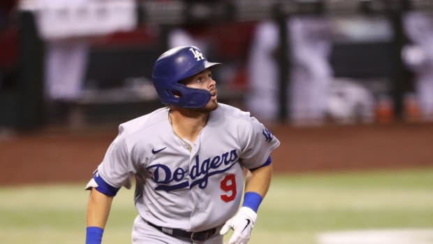 Sep 8, 2020; Phoenix, Arizona, USA; Los Angeles Dodgers second baseman Gavin Lux hits a three run home run in the tenth inning against the Arizona Diamondbacks at Chase Field. Mandatory Credit: Mark J. Rebilas-USA TODAY Sports